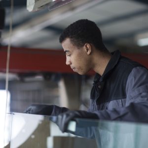 worker in a car glazing service